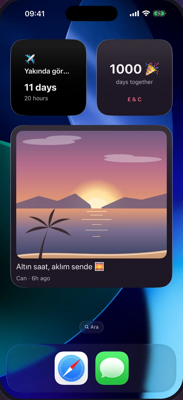 Dearly widget’larıyla bir iPhone ana ekranı: bir sonraki ziyarete 11 günlük geri sayım, birlikte 1.000 gün sayacı ve Can’ın 6 saat önce paylaştığı bir gün batımı fotoğrafı.
